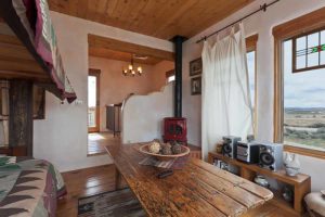 Taos vacation home rental upstairs: stove & table